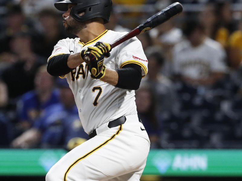 Sep 25, 2024; Pittsburgh, Pennsylvania, USA;  Pittsburgh Pirates third baeman Isiah Kiner-Falefa (7) hits a single against the Milwaukee Brewers during the fourth inning at PNC Park. Mandatory Credit: Charles LeClaire-Imagn Images