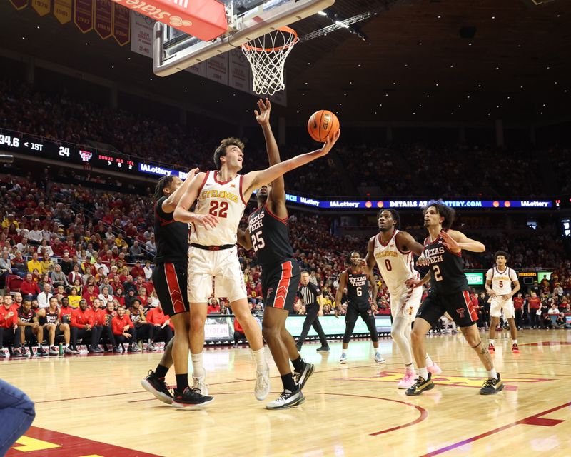 Feb 17, 2024; Ames, Iowa, USA; Iowa State Cyclones forward Milan Momcilovic (22) shoots the ball against Texas Tech Red Raiders forward Robert Jennings (25) during the first half at James H. Hilton Coliseum. Mandatory Credit: Reese Strickland-USA TODAY Sports