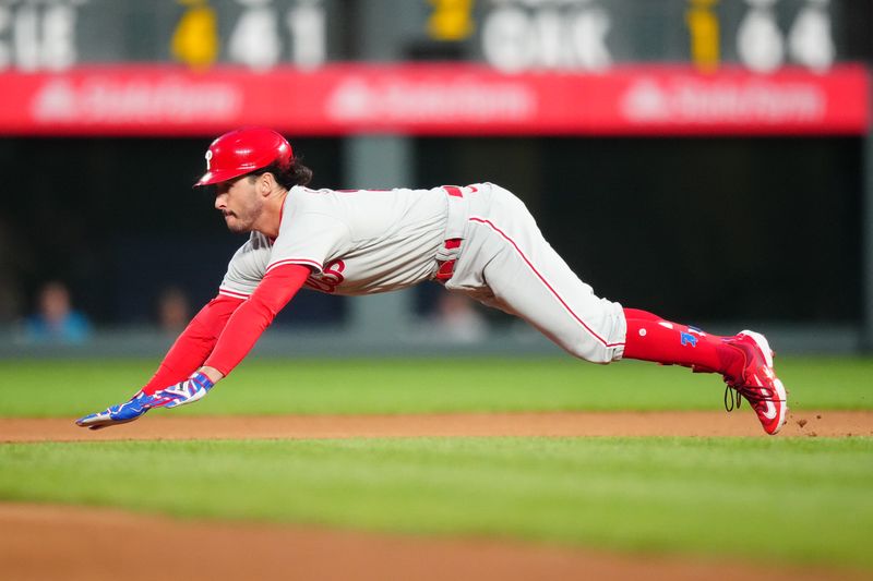 May 12, 2023; Denver, Colorado, USA; Philadelphia Phillies designated hitter Garrett Stubbs (21) dives for a double in the seventh inning against the Colorado Rockies at Coors Field. Mandatory Credit: Ron Chenoy-USA TODAY Sports