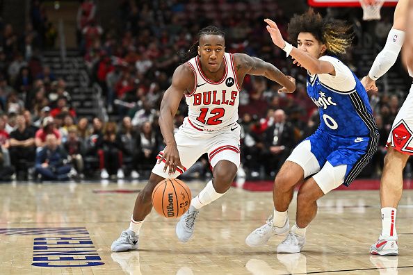 CHICAGO, ILLINOIS - NOVEMBER 15:  Ayo Dosunmu #12 of the Chicago Bulls controls the ball against the Orlando Magic on November 15, 2023 at United Center in Chicago, Illinois.   NOTE TO USER: User expressly acknowledges and agrees that, by downloading and or using this photograph, User is consenting to the terms and conditions of the Getty Images License Agreement.  (Photo by Jamie Sabau/Getty Images)