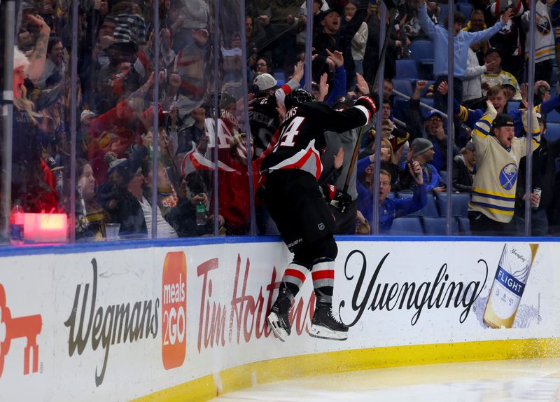 Mar 2, 2024; Buffalo, New York, USA;  Buffalo Sabres center Dylan Cozens (24) reacts after scoring a shorthanded goal during the second period against the Vegas Golden Knights at KeyBank Center. Mandatory Credit: Timothy T. Ludwig-USA TODAY Sports