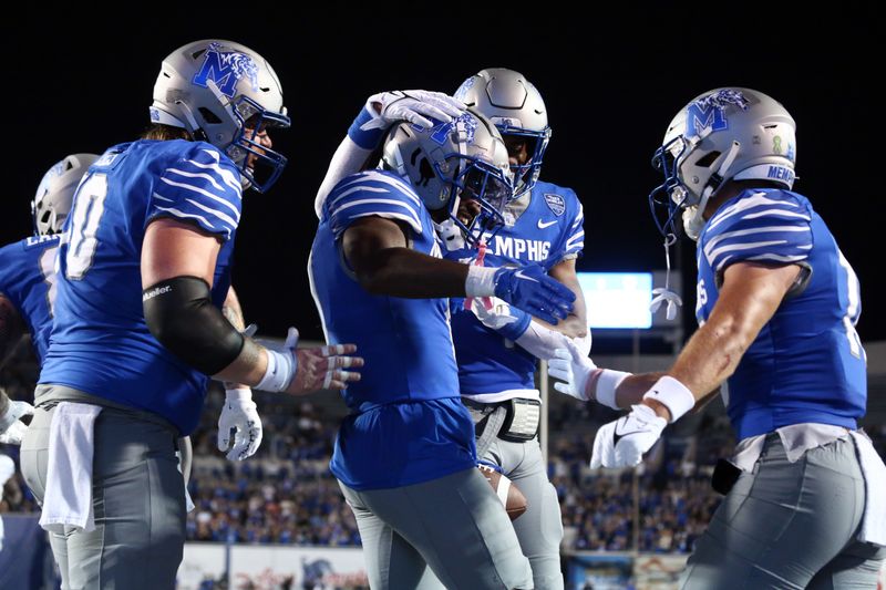 Oct 13, 2023; Memphis, Tennessee, USA; Memphis Tigers wide receiver Demeer Blankumsee (0) reacts with teammates after a touchdown catch during the first half against the Tulane Green Wave at Simmons Bank Liberty Stadium. Mandatory Credit: Petre Thomas-USA TODAY Sports