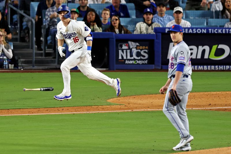 Oct 20, 2024; Los Angeles, California, USA; Los Angeles Dodgers catcher Will Smith (16) hits a two run home run during the third inning  against the New York Mets during game six of the NLCS for the 2024 MLB playoffs at Dodger Stadium. Mandatory Credit: Jason Parkhurst-Imagn Images