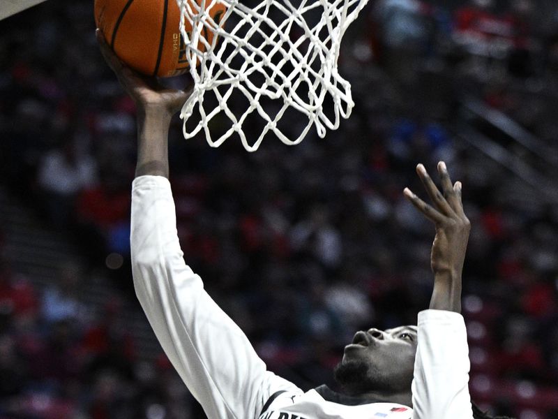 Nov 27, 2023; San Diego, California, USA; San Diego State Aztecs forward Jay Pal (4) goes to the basket during the first half against the Point Loma Nazarene Sea Lions at Viejas Arena. Mandatory Credit: Orlando Ramirez-USA TODAY Sports