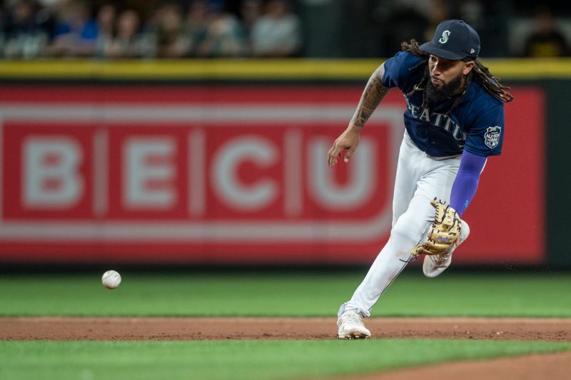 Aug 9, 2023; Seattle, Washington, USA; Seattle Mariners shortstop J.P. Crawford (3) fields a ground ball during the eighth inning against the San Diego Padres at T-Mobile Park. Mandatory Credit: Stephen Brashear-USA TODAY Sports