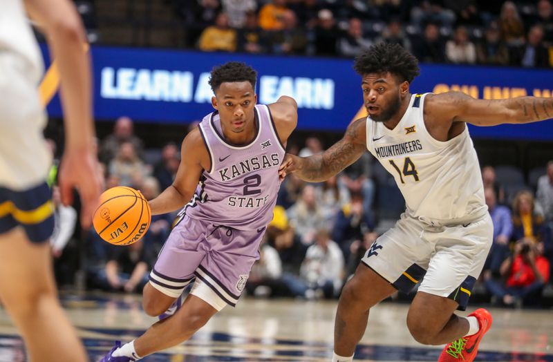 Jan 9, 2024; Morgantown, West Virginia, USA; Kansas State Wildcats guard Tylor Perry (2) drives against West Virginia Mountaineers guard Seth Wilson (14) during the first half at WVU Coliseum. Mandatory Credit: Ben Queen-USA TODAY Sports