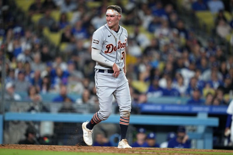 Sep 20, 2023; Los Angeles, California, USA; Detroit Tigers right fielder Kerry Carpenter (30) reacts after scoring against the Los Angeles Dodgers in the eighth inning at Dodger Stadium. Mandatory Credit: Kirby Lee-USA TODAY Sports