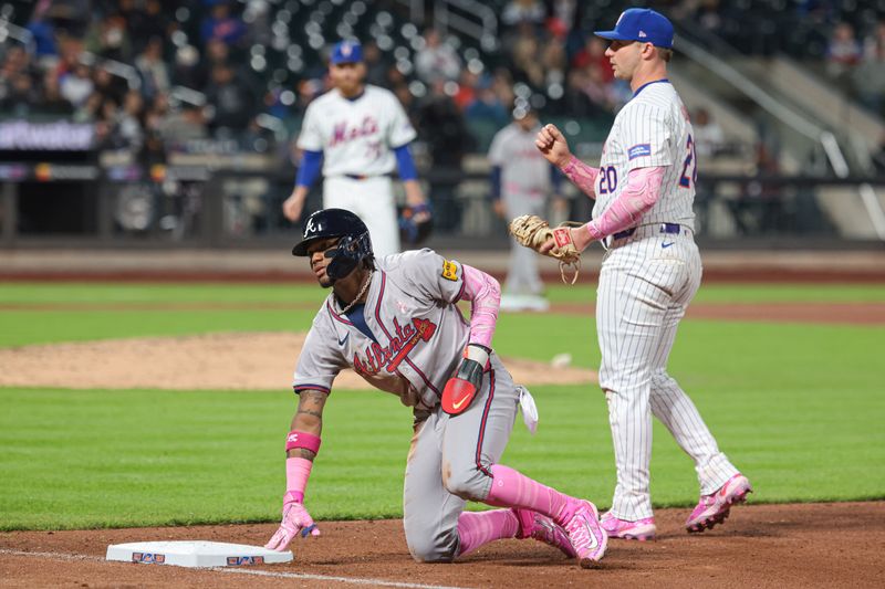 May 12, 2024; New York City, New York, USA; Atlanta Braves right fielder Ronald Acuna Jr. (13) reacts being called out by umpire DJ Reyburn (17) on a pick off play by New York Mets relief pitcher Reed Garrett (75) and first baseman Pete Alonso (20) during the seventh inning at Citi Field. Acuna was out after a video review. Mandatory Credit: Vincent Carchietta-USA TODAY Sports