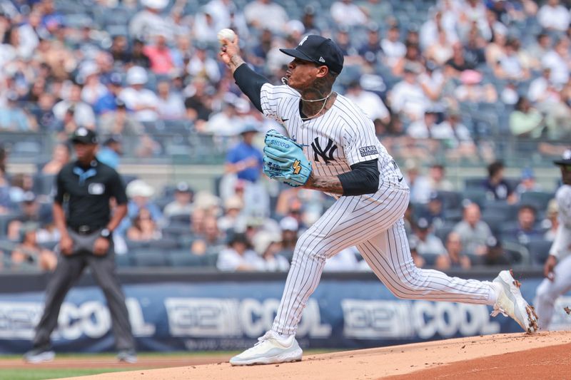 Aug 11, 2024; Bronx, New York, USA; New York Yankees starting pitcher Marcus Stroman (0) delivers a pitch during the first inning against the Texas Rangers at Yankee Stadium. Mandatory Credit: Vincent Carchietta-USA TODAY Sports