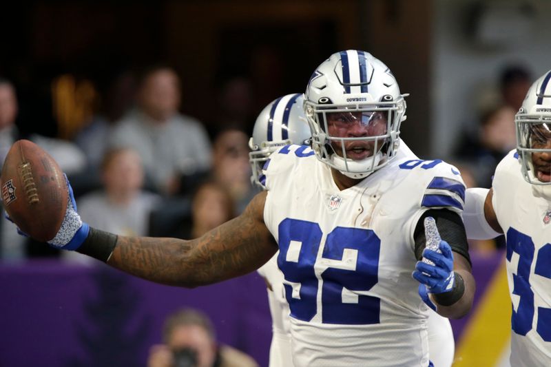 Dallas Cowboys defensive end Dorance Armstrong (92) celebrates after recovering a fumble by Minnesota Vikings quarterback Kirk Cousins during the first half of an NFL football game, Sunday, Nov. 20, 2022, in Minneapolis. (AP Photo/Andy Clayton-King)