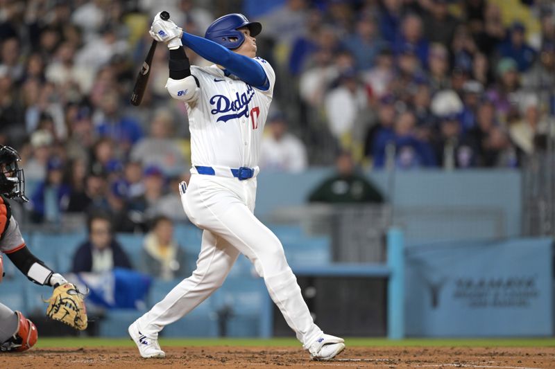 Apr 2, 2024; Los Angeles, California, USA; Los Angeles Dodgers designated hitter Shohei Ohtani (17) flies out in the third inning against the San Francisco Giants at Dodger Stadium. Mandatory Credit: Jayne Kamin-Oncea-USA TODAY Sports