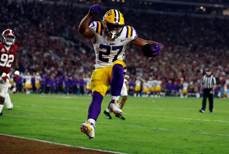 Nov 4, 2023; Tuscaloosa, Alabama, USA; LSU Tigers running back Josh Williams (27) carries the ball in for a touchdown against the Alabama Crimson Tide during the second half at Bryant-Denny Stadium. Mandatory Credit: Butch Dill-USA TODAY Sports