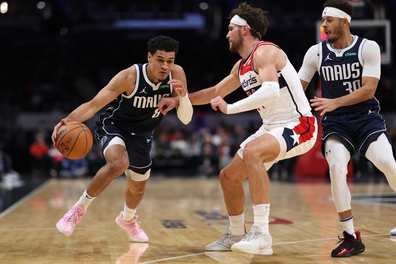 WASHINGTON, DC - NOVEMBER 15: Josh Green #8 of the Dallas Mavericks dribbles in front of Corey Kispert #24 of the Washington Wizards during the first half at Capital One Arena on November 15, 2023 in Washington, DC. NOTE TO USER: User expressly acknowledges and agrees that, by downloading and or using this photograph, User is consenting to the terms and conditions of the Getty Images License Agreement. (Photo by Patrick Smith/Getty Images)