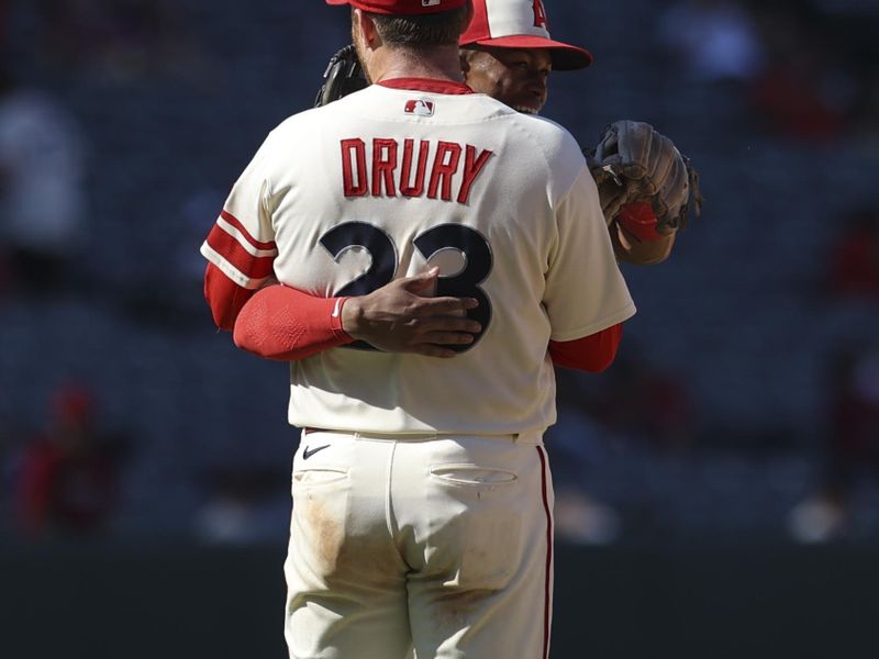 Sep 10, 2023; Anaheim, California, USA; Los Angeles Angels second baseman Brandon Drury (23) and Los Angeles Angels second baseman Kyren Paris (19) embrace after the Los Angeles Angels defeat the Cleveland Guardians at Angel Stadium. Mandatory Credit: Jessica Alcheh-USA TODAY Sports