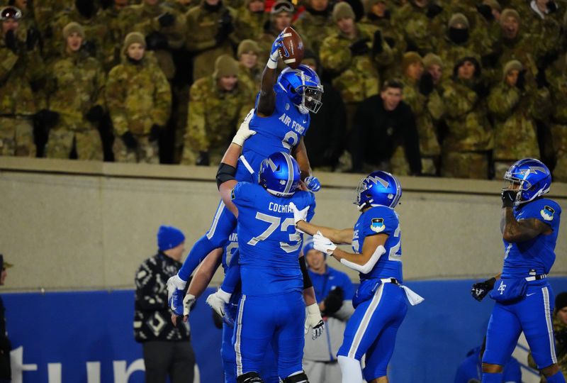 Nov 19, 2022; Colorado Springs, Colorado, USA; Air Force Falcons wide receiver DeAndre Hughes (8) celebrates with offensive lineman Isaac Cochran (73) after scoring a touchdown against the Colorado State Rams in the first quarter at Falcon Stadium. Mandatory Credit: Ron Chenoy-USA TODAY Sports