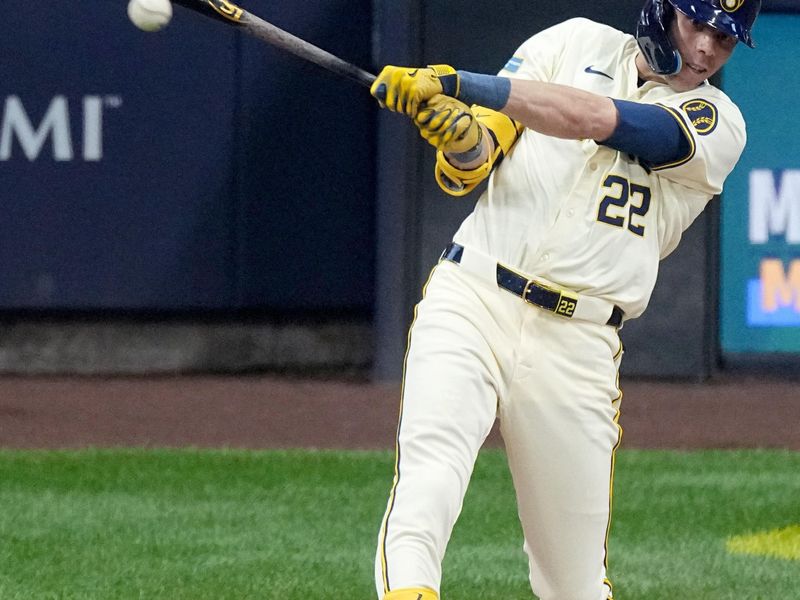 May 14, 2024; Milwaukee, Wisconsin, USA; Milwaukee Brewers outfielder Christian Yelich (22) hits an RBI single during the second inning of their game against the Pittsburgh Pirates at American Family Field. Mandatory Credit: Mark Hoffman-USA TODAY Sports