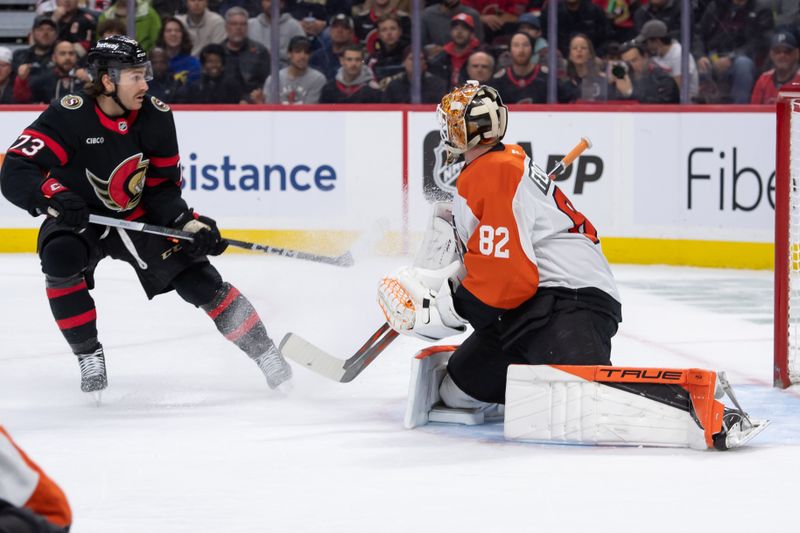 Nov 14, 2024; Ottawa, Ontario, CAN; Ottawa Senators left wing Noah Gregor (73) follows the puck as it travels past Philadelphia Flyers goalie Ivan Fedotov (82) in the first period at the Canadian Tire Centre. Mandatory Credit: Marc DesRosiers-Imagn Images