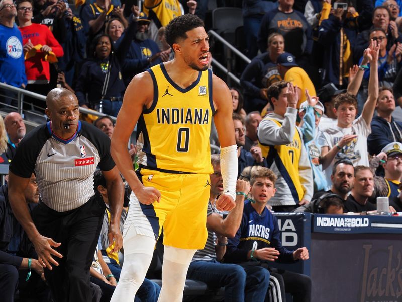 INDIANAPOLIS, IN - OCTOBER 27: Tyrese Haliburton #0 of the Indiana Pacers celebrates during the game against the Philadelphia 76ers on October 27, 2024 at Gainbridge Fieldhouse in Indianapolis, Indiana. NOTE TO USER: User expressly acknowledges and agrees that, by downloading and or using this Photograph, user is consenting to the terms and conditions of the Getty Images License Agreement. Mandatory Copyright Notice: Copyright 2024 NBAE (Photo by Ron Hoskins/NBAE via Getty Images)