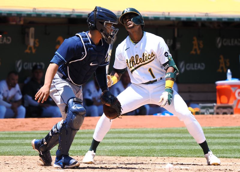 Jun 15, 2023; Oakland, California, USA; Oakland Athletics center fielder Esteury Ruiz (1) reacts after striking out ahead of Tampa Bay Rays catcher Francisco Mejia (21) during the third inning at Oakland-Alameda County Coliseum. Mandatory Credit: Kelley L Cox-USA TODAY Sports