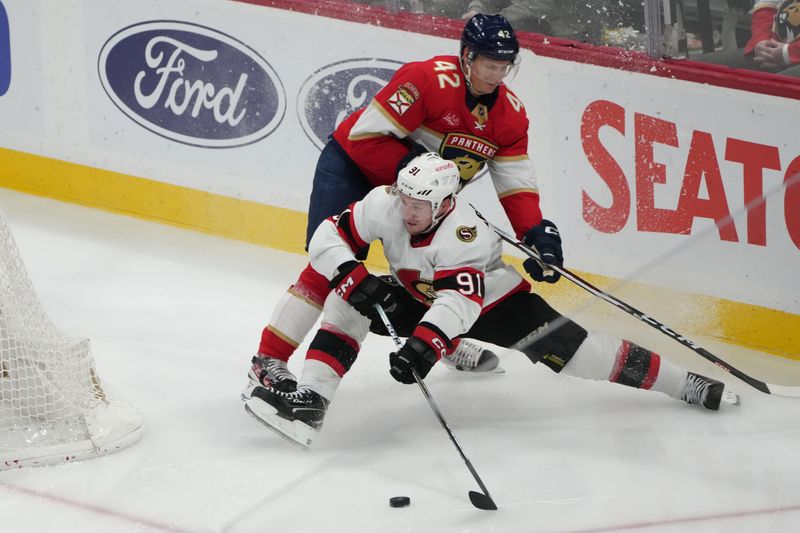 Feb 20, 2024; Sunrise, Florida, USA; Ottawa Senators right wing Vladimir Tarasenko (91) looks to pass the puck as Florida Panthers defenseman Gustav Forsling (42) defends during the third period at Amerant Bank Arena. Mandatory Credit: Jim Rassol-USA TODAY Sports