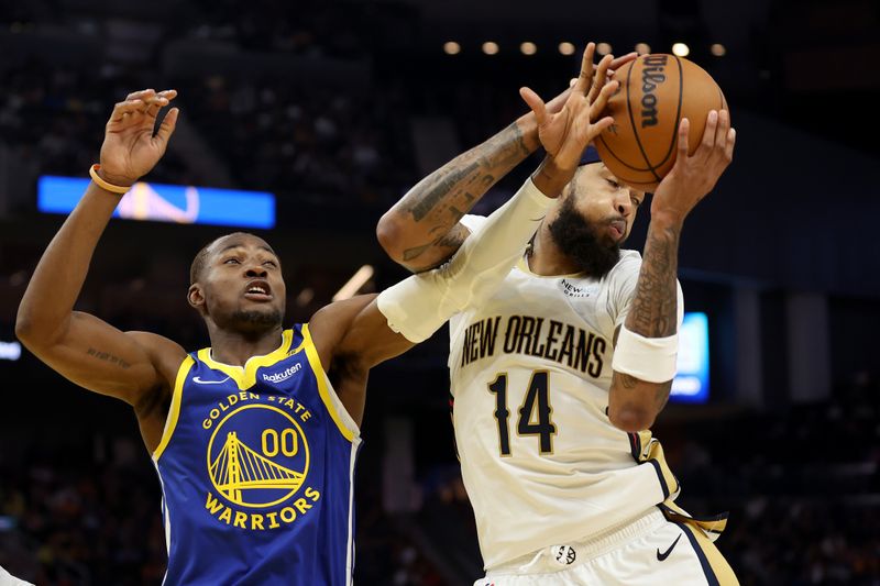 SAN FRANCISCO, CALIFORNIA - OCTOBER 30: Jonathan Kuminga #00 of the Golden State Warriors and Brandon Ingram #14 of the New Orleans Pelicans go for a rebound in the second quarter at Chase Center on October 30, 2024 in San Francisco, California. NOTE TO USER: User expressly acknowledges and agrees that, by downloading and/or using this photograph, user is consenting to the terms and conditions of the Getty Images License Agreement.  (Photo by Ezra Shaw/Getty Images)