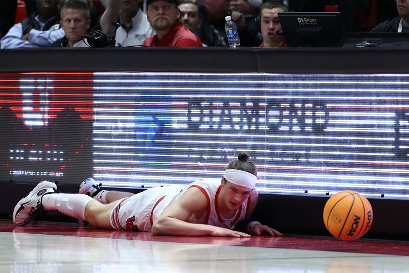 Dec 5, 2023; Salt Lake City, Utah, USA; Utah Utes guard Gabe Madsen (55) dives for a ball against the Southern Utah Thunderbirds during the first half at Jon M. Huntsman Center. Mandatory Credit: Rob Gray-USA TODAY Sports