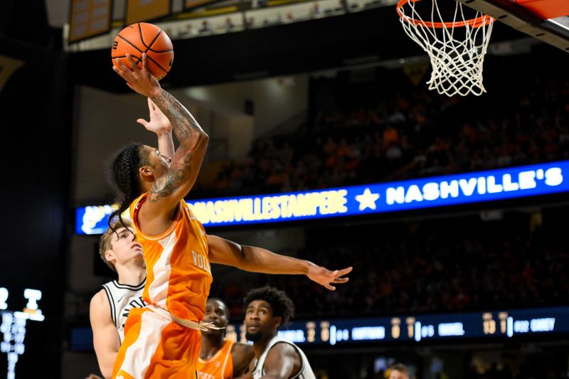 Jan 18, 2025; Nashville, Tennessee, USA;  Tennessee Volunteers guard Zakai Zeigler (5) lays the ball in against the Vanderbilt Commodores during the second half at Memorial Gymnasium. Mandatory Credit: Steve Roberts-Imagn Images