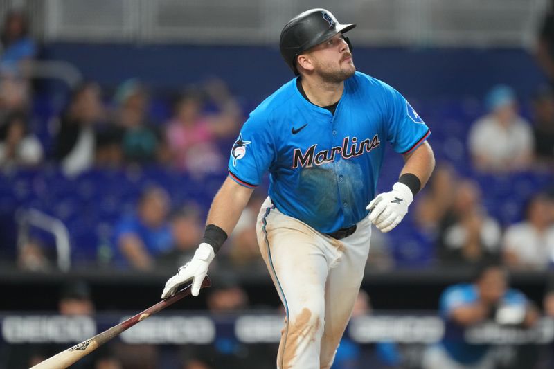 Jun 9, 2024; Miami, Florida, USA;  Miami Marlins third baseman Jake Burger (36) hits a home run in the ninth inning against the Cleveland Guardians at loanDepot Park. Mandatory Credit: Jim Rassol-USA TODAY Sports