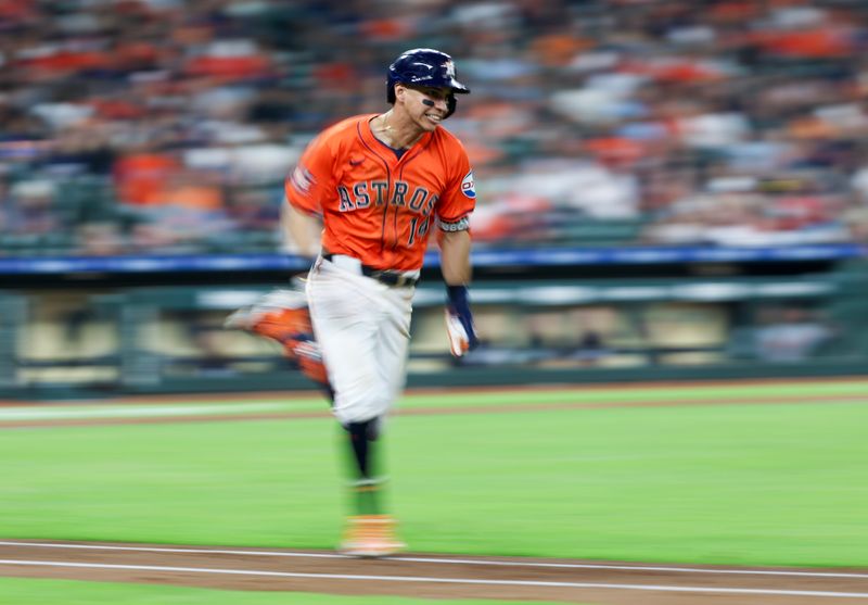 Jun 14, 2024; Houston, Texas, USA;  Houston Astros first baseman Mauricio Dubon (14) runs down the first baseline against the Detroit Tigers in the fourth inning at Minute Maid Park. Mandatory Credit: Thomas Shea-USA TODAY Sports