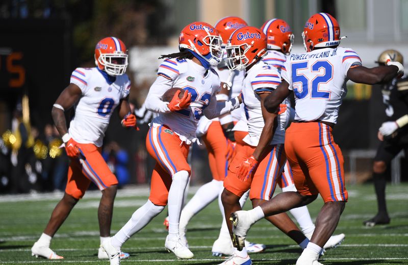 Nov 19, 2022; Nashville, Tennessee, USA; Florida Gators cornerback Jaydon Hill (23) celebrates with teammates after recovering a fumble during the first half against the Vanderbilt Commodores at FirstBank Stadium. Mandatory Credit: Christopher Hanewinckel-USA TODAY Sports