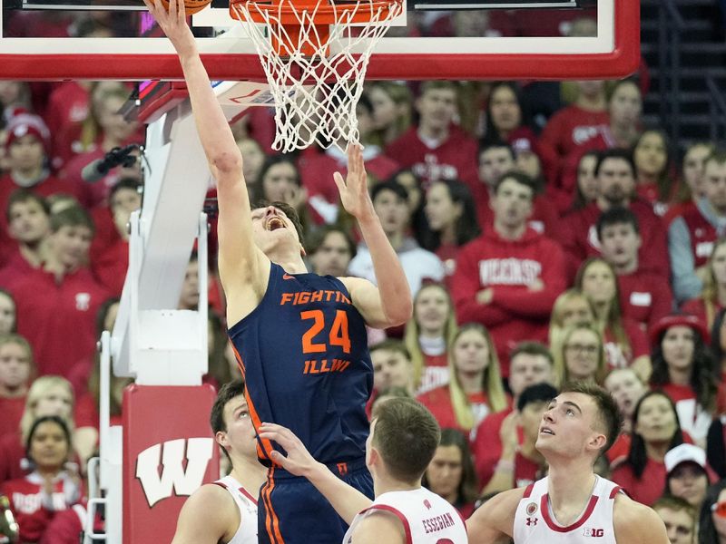 Jan 28, 2023; Madison, Wisconsin, USA;  Illinois Fighting Illini forward Matthew Mayer (24) scores against Wisconsin Badgers guard Connor Essegian (3) and Wisconsin Badgers forward Tyler Wahl (5) during the second half at the Kohl Center. Mandatory Credit: Kayla Wolf-USA TODAY Sports