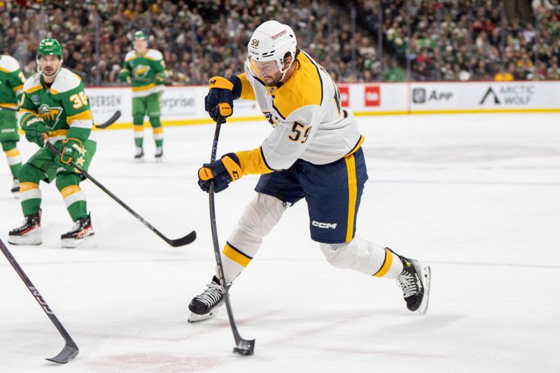 Dec 31, 2024; Saint Paul, Minnesota, USA; Nashville Predators defenseman Roman Josi (59) shoots against the Minnesota Wild in the first period at Xcel Energy Center. Mandatory Credit: Matt Blewett-Imagn Images