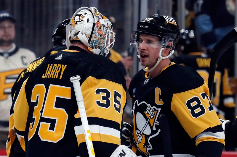 Feb 25, 2024; Pittsburgh, Pennsylvania, USA;  Pittsburgh Penguins goaltender Tristan Jarry (35) and center Sidney Crosby (87) celebrate after defeating the Philadelphia Flyers at PPG Paints Arena. Pittsburgh won 7-6. Mandatory Credit: Charles LeClaire-USA TODAY Sports