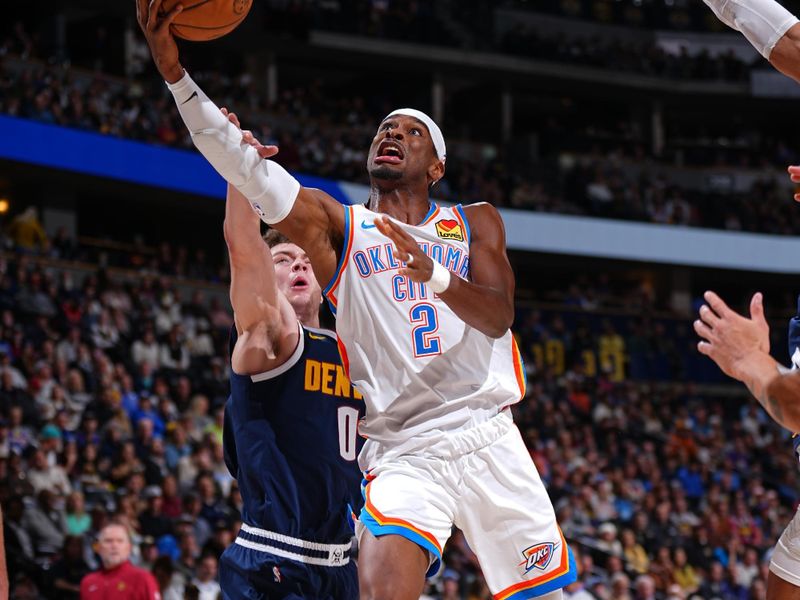 DENVER, CO - NOVEMBER 6: Shai Gilgeous-Alexander #2 of the Oklahoma City Thunder drives to the basket during the game against the Denver Nuggets on November 6, 2024 at Ball Arena in Denver, Colorado. NOTE TO USER: User expressly acknowledges and agrees that, by downloading and/or using this Photograph, user is consenting to the terms and conditions of the Getty Images License Agreement. Mandatory Copyright Notice: Copyright 2024 NBAE (Photo by Garrett Ellwood/NBAE via Getty Images)