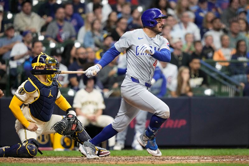 May 28, 2024; Milwaukee, Wisconsin, USA;  Chicago Cubs right fielder Mike Tauchman (40) singles during the tenth inning against the Milwaukee Brewers at American Family Field. Mandatory Credit: Jeff Hanisch-USA TODAY Sports