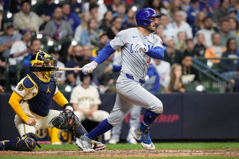 May 28, 2024; Milwaukee, Wisconsin, USA;  Chicago Cubs right fielder Mike Tauchman (40) singles during the tenth inning against the Milwaukee Brewers at American Family Field. Mandatory Credit: Jeff Hanisch-USA TODAY Sports