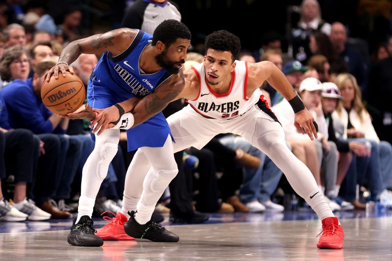 DALLAS, TEXAS - JANUARY 05: Kyrie Irving #11 of the Dallas Mavericks is guarded by Toumani Camara #33 of the Portland Trail Blazers in the first half at American Airlines Center on January 05, 2024 in Dallas, Texas. NOTE TO USER: User expressly acknowledges and agrees that, by downloading and or using this photograph, User is consenting to the terms and conditions of the Getty Images License Agreement. (Photo by Tim Heitman/Getty Images)