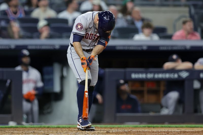 May 8, 2024; Bronx, New York, USA; Houston Astros second baseman Jose Altuve (27) reacts after hitting a fly ball to center field during the fifth inning against the New York Yankees at Yankee Stadium. Mandatory Credit: Brad Penner-USA TODAY Sports