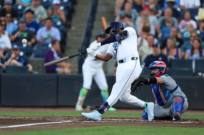 May 24, 2025; Tampa, Florida, USA; Tampa Bay Rays third baseman Junior Caminero (13) hits a three run home run against the Toronto Blue Jays in the first inning at George M. Steinbrenner Field. Mandatory Credit: Nathan Ray Seebeck-Imagn Images