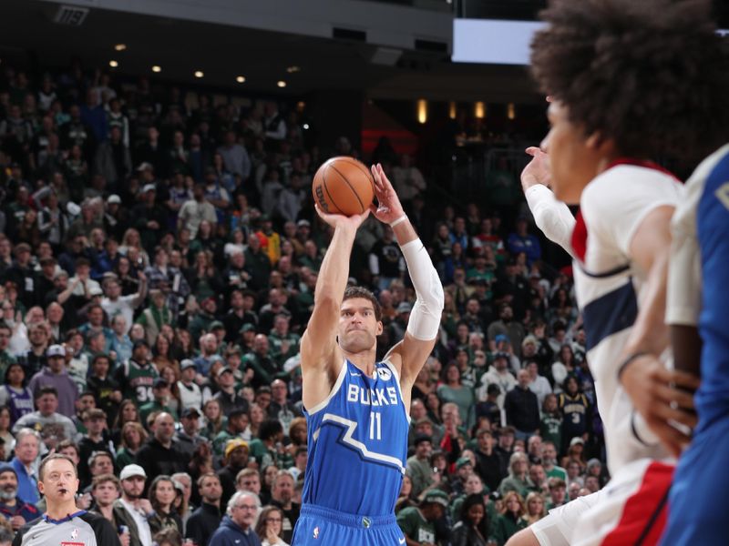 MILWAUKEE, WI - NOVEMBER 30: Brook Lopez #11 of the Milwaukee Bucks shoots a three point basket during the game against the Washington Wizards on November 30, 2024 at Fiserv Forum Center in Milwaukee, Wisconsin. NOTE TO USER: User expressly acknowledges and agrees that, by downloading and or using this Photograph, user is consenting to the terms and conditions of the Getty Images License Agreement. Mandatory Copyright Notice: Copyright 2024 NBAE (Photo by Gary Dineen/NBAE via Getty Images).