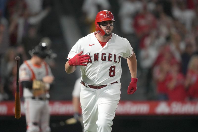 Aug 9, 2023; Anaheim, California, USA; Los Angeles Angels third baseman Mike Moustakas (8) drops the bat after hitting a three-run home run in the sixth inning against the San Francisco Giants at Angel Stadium. Mandatory Credit: Kirby Lee-USA TODAY Sports