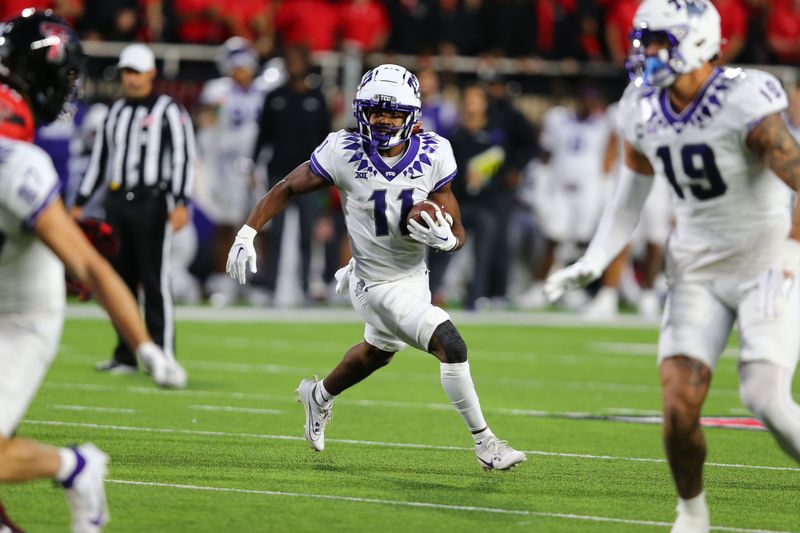 Nov 2, 2023; Lubbock, Texas, USA; Texas Christian Horned Frogs wide receiver JoJo Earle (11) rushes against the Texas Tech Red Raiders in the first half at Jones AT&T Stadium and Cody Campbell Field. Mandatory Credit: Michael C. Johnson-USA TODAY Sports