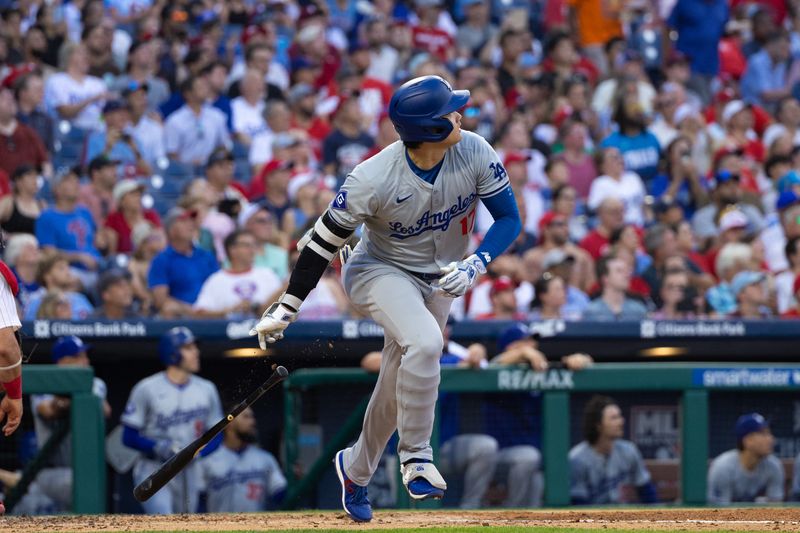 Jul 9, 2024; Philadelphia, Pennsylvania, USA; Los Angeles Dodgers two-way player Shohei Ohtani (17) hits a single during the third inning against the Philadelphia Phillies at Citizens Bank Park. Mandatory Credit: Bill Streicher-USA TODAY Sports