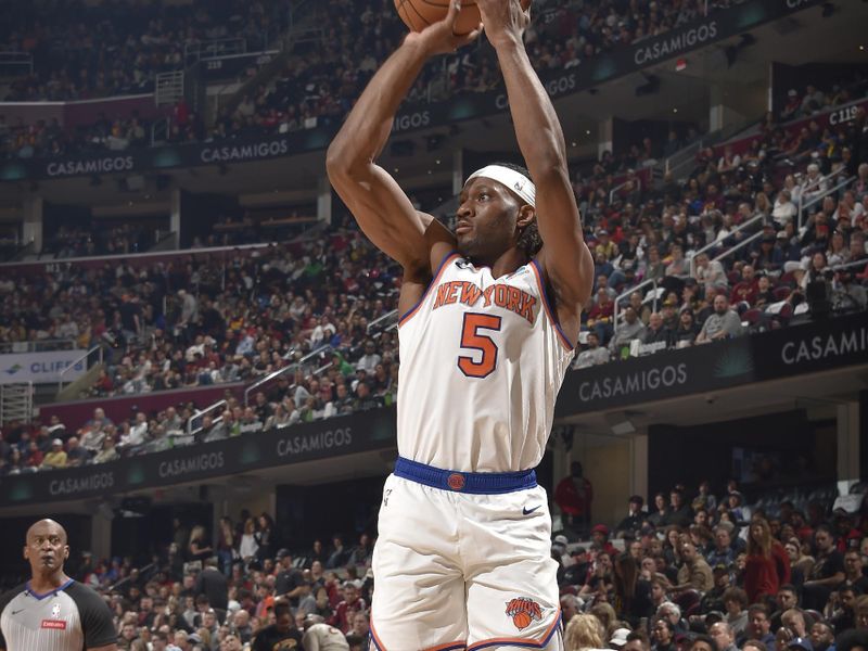 CLEVELAND, OH - MARCH 3:  Precious Achiuwa #5 of the New York Knicks shoots a 3-point basket during the game  on March 3, 2024 at Rocket Mortgage FieldHouse in Cleveland, Ohio. NOTE TO USER: User expressly acknowledges and agrees that, by downloading and/or using this Photograph, user is consenting to the terms and conditions of the Getty Images License Agreement. Mandatory Copyright Notice: Copyright 2024 NBAE (Photo by David Liam Kyle/NBAE via Getty Images)