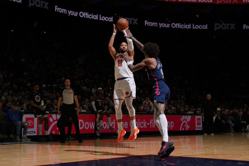 PHILADELPHIA, PA - FEBRUARY 22: Jalen Brunson #11 of the New York Knicks shoots a three point basket against the Philadelphia 76ers on February 22, 2024 at the Wells Fargo Center in Philadelphia, Pennsylvania NOTE TO USER: User expressly acknowledges and agrees that, by downloading and/or using this Photograph, user is consenting to the terms and conditions of the Getty Images License Agreement. Mandatory Copyright Notice: Copyright 2024 NBAE (Photo by Jesse D. Garrabrant/NBAE via Getty Images)