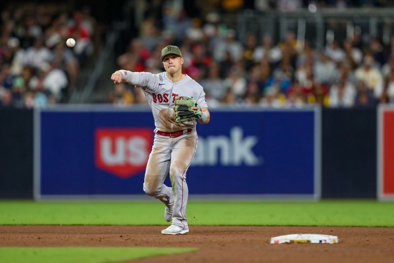 May 20, 2023; San Diego, California, USA; Boston Red Sox shortstop Enrique Hernandez (5) throws to first base during the fourth inning to record the out against the San Diego Padres at Petco Park. Mandatory Credit: David Frerker-USA TODAY Sports