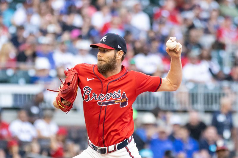 Aug 23, 2024; Cumberland, Georgia, USA; Atlanta Braves pitcher Chris Sale (51) pitches against Washington Nationals during the first inning at Truist Park. Mandatory Credit: Jordan Godfree-USA TODAY Sports