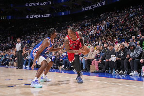 PHILADELPHIA, PA - DECEMBER 18: DeMar DeRozan #11 of the Chicago Bulls looks to pass the ball during the game against the Philadelphia 76ers on December 18, 2023 at the Wells Fargo Center in Philadelphia, Pennsylvania NOTE TO USER: User expressly acknowledges and agrees that, by downloading and/or using this Photograph, user is consenting to the terms and conditions of the Getty Images License Agreement. Mandatory Copyright Notice: Copyright 2023 NBAE (Photo by Jesse D. Garrabrant/NBAE via Getty Images)