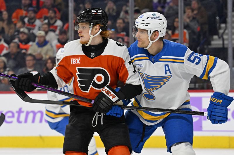 Nov 20, 2025; Philadelphia, Pennsylvania, USA; Philadelphia Flyers right wing Owen Tippett (74) and St. Louis Blues defenseman Colton Parayko (55) battle for position during the first period at Xfinity Mobile Arena. Mandatory Credit: Eric Hartline-Imagn Images