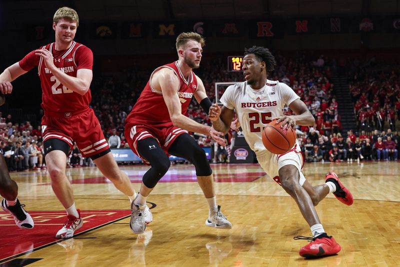 Feb 10, 2024; Piscataway, New Jersey, USA; Rutgers Scarlet Knights guard Jeremiah Williams (25) dribbles the ball against Wisconsin Badgers forward Tyler Wahl (5) during the second half at Jersey Mike's Arena. Mandatory Credit: Vincent Carchietta-USA TODAY Sports